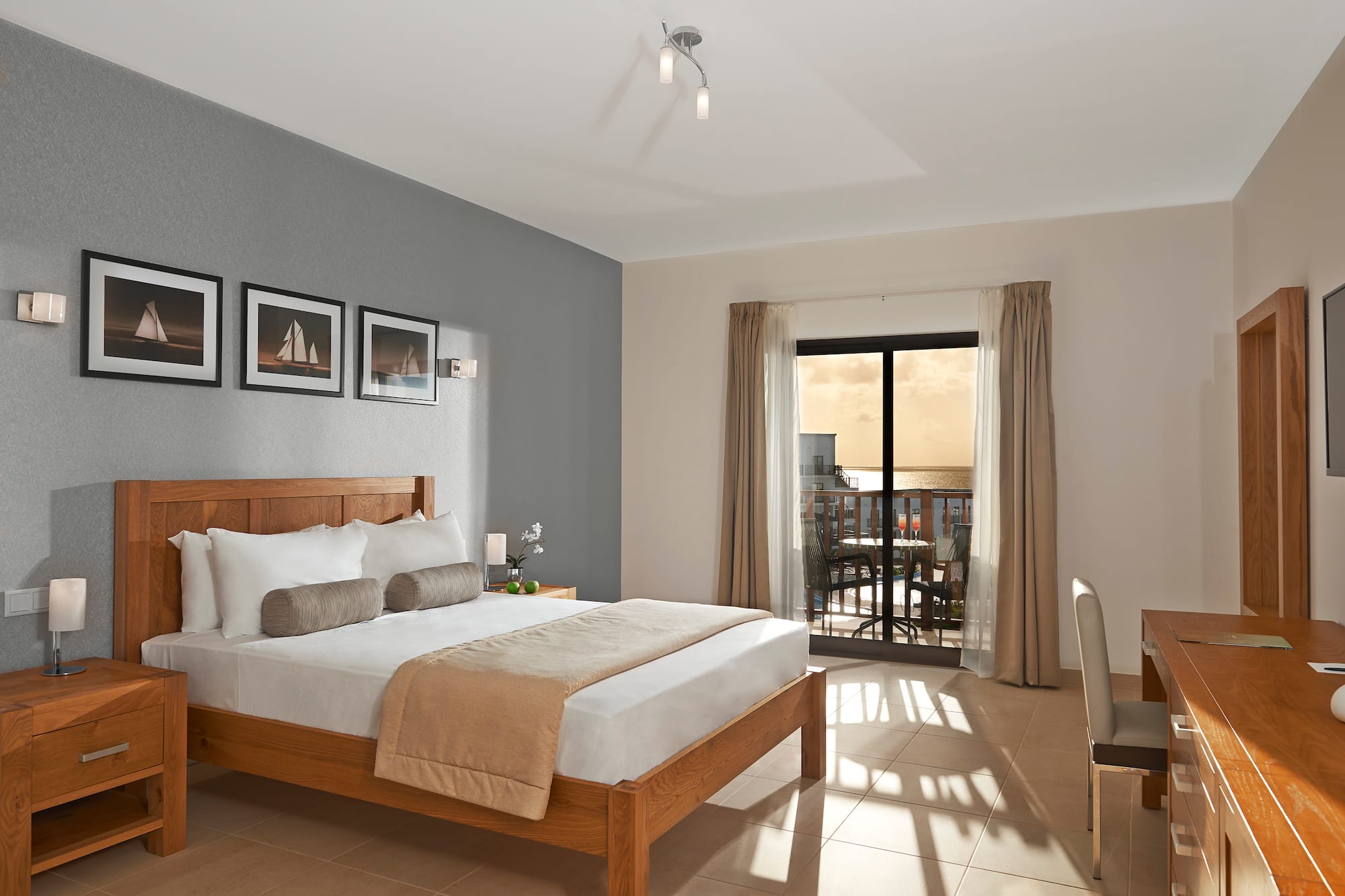 a bedroom with a bed and a glass door