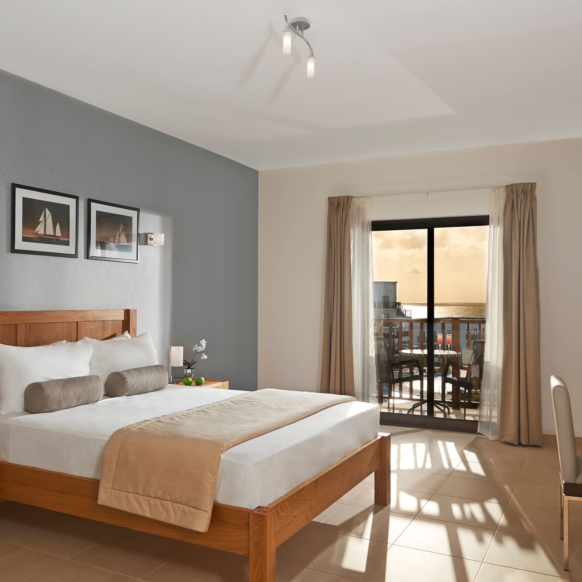 a bedroom with a bed and a glass door