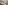 a bedroom with a bed and a glass door
