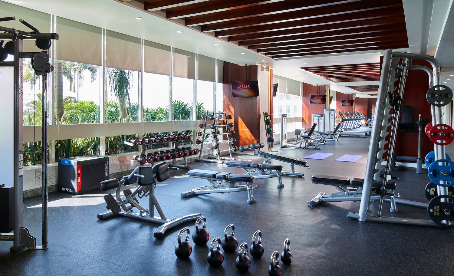 a large room with exercise equipment