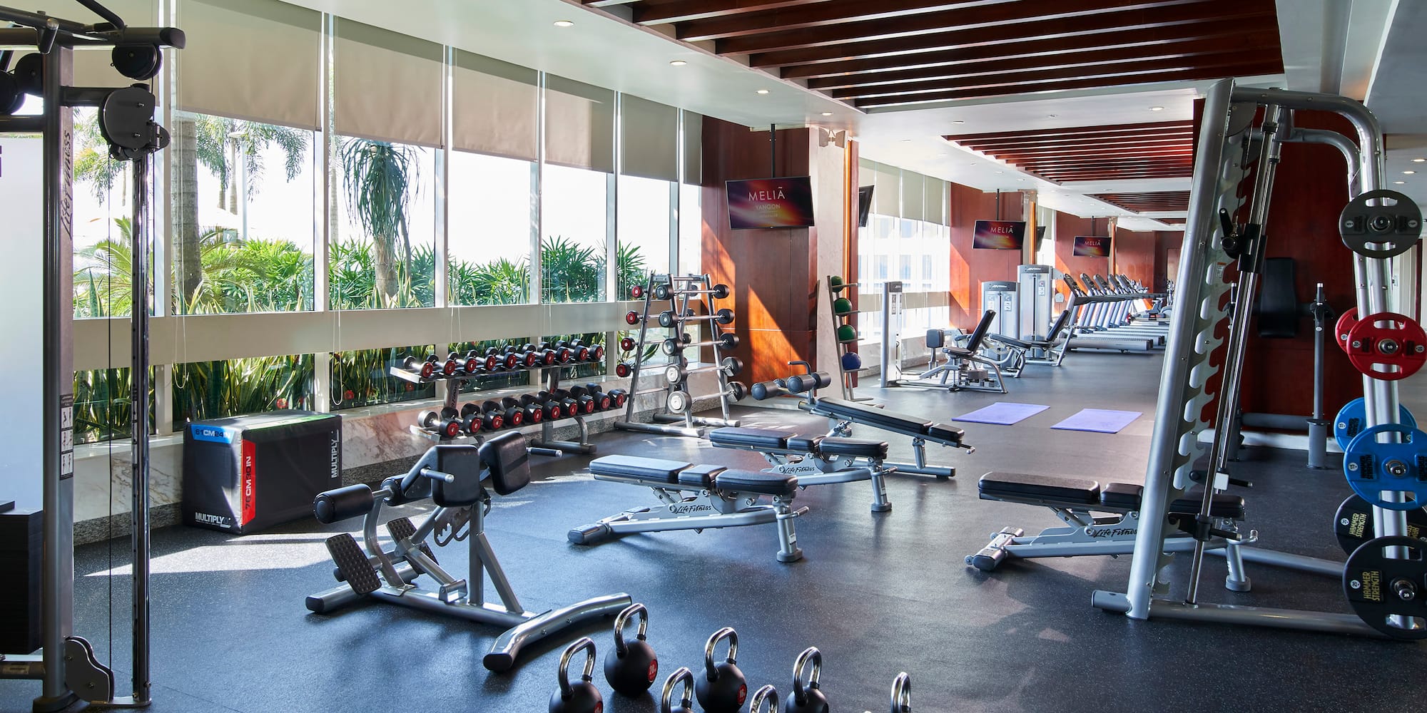 a large room with exercise equipment
