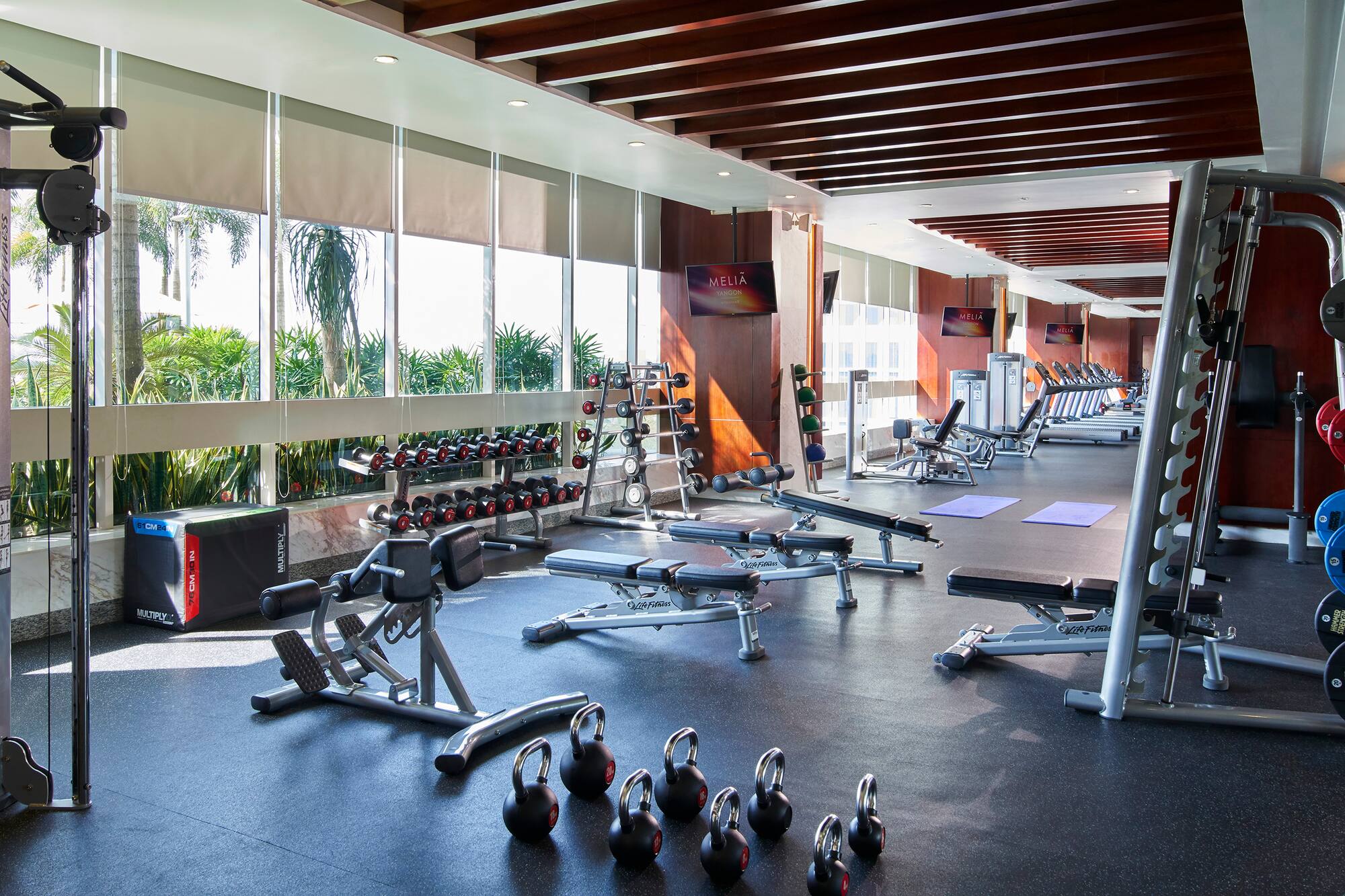 a large room with exercise equipment
