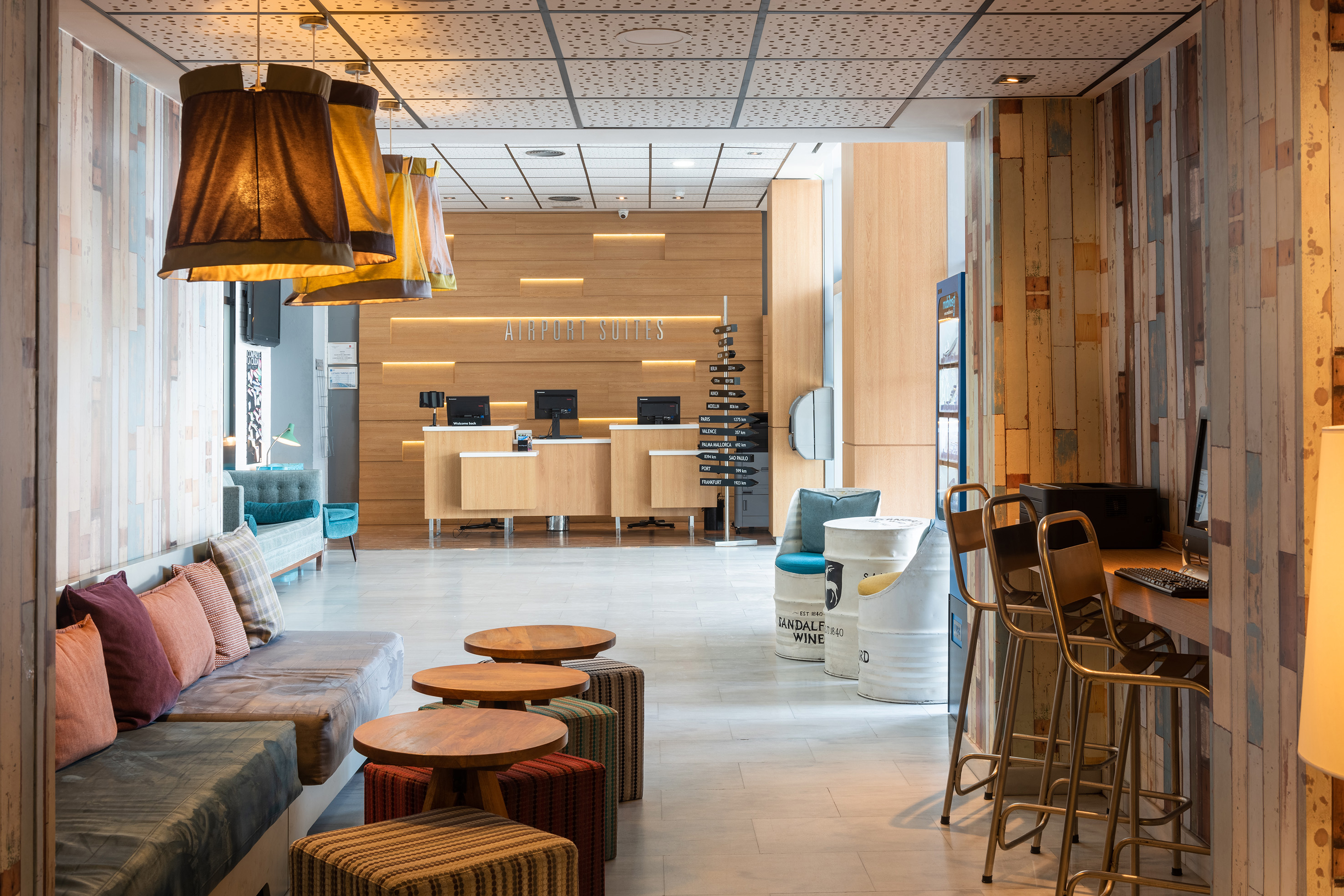 a lobby with a couch and tables