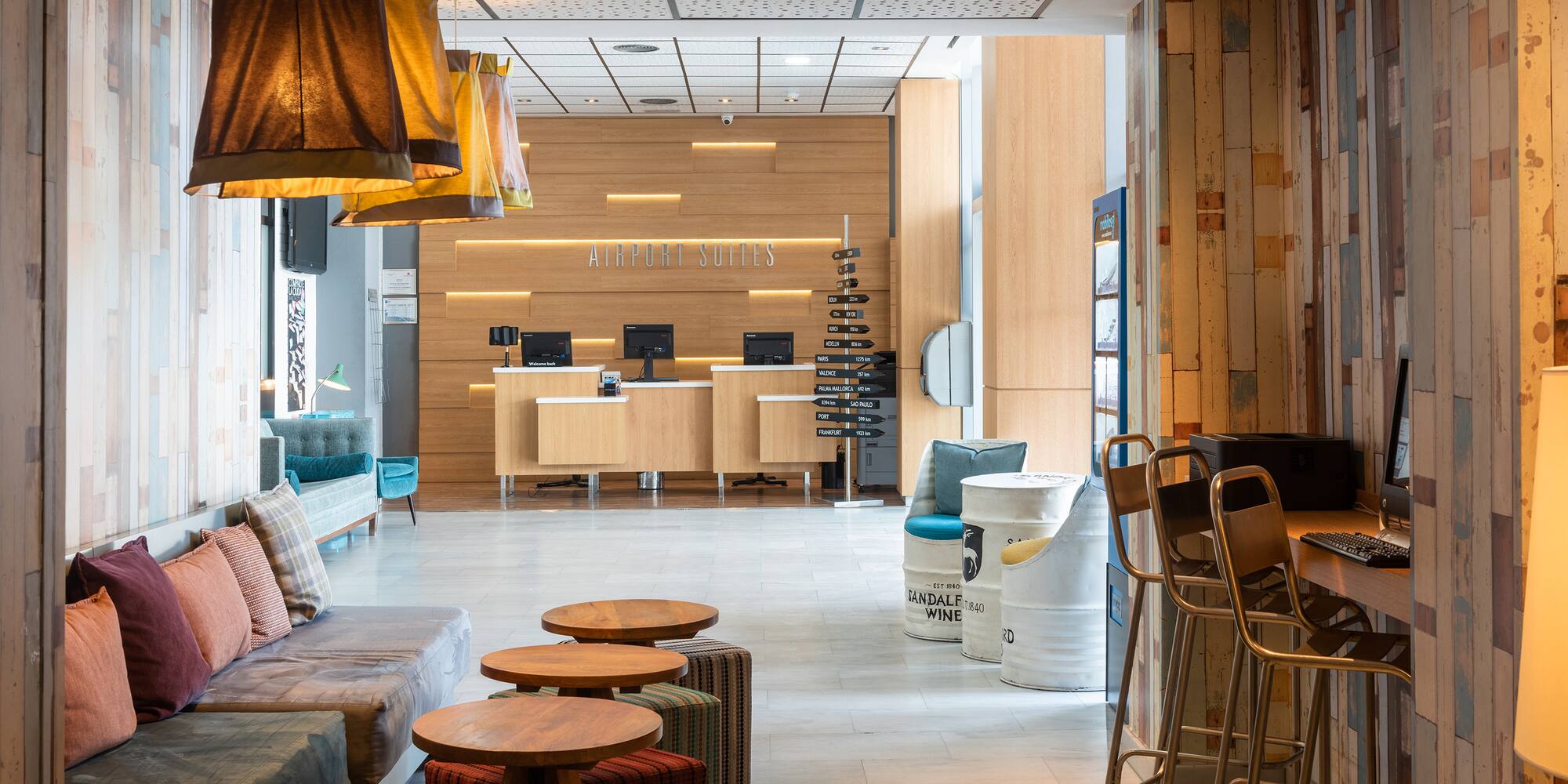 a lobby with a couch and tables