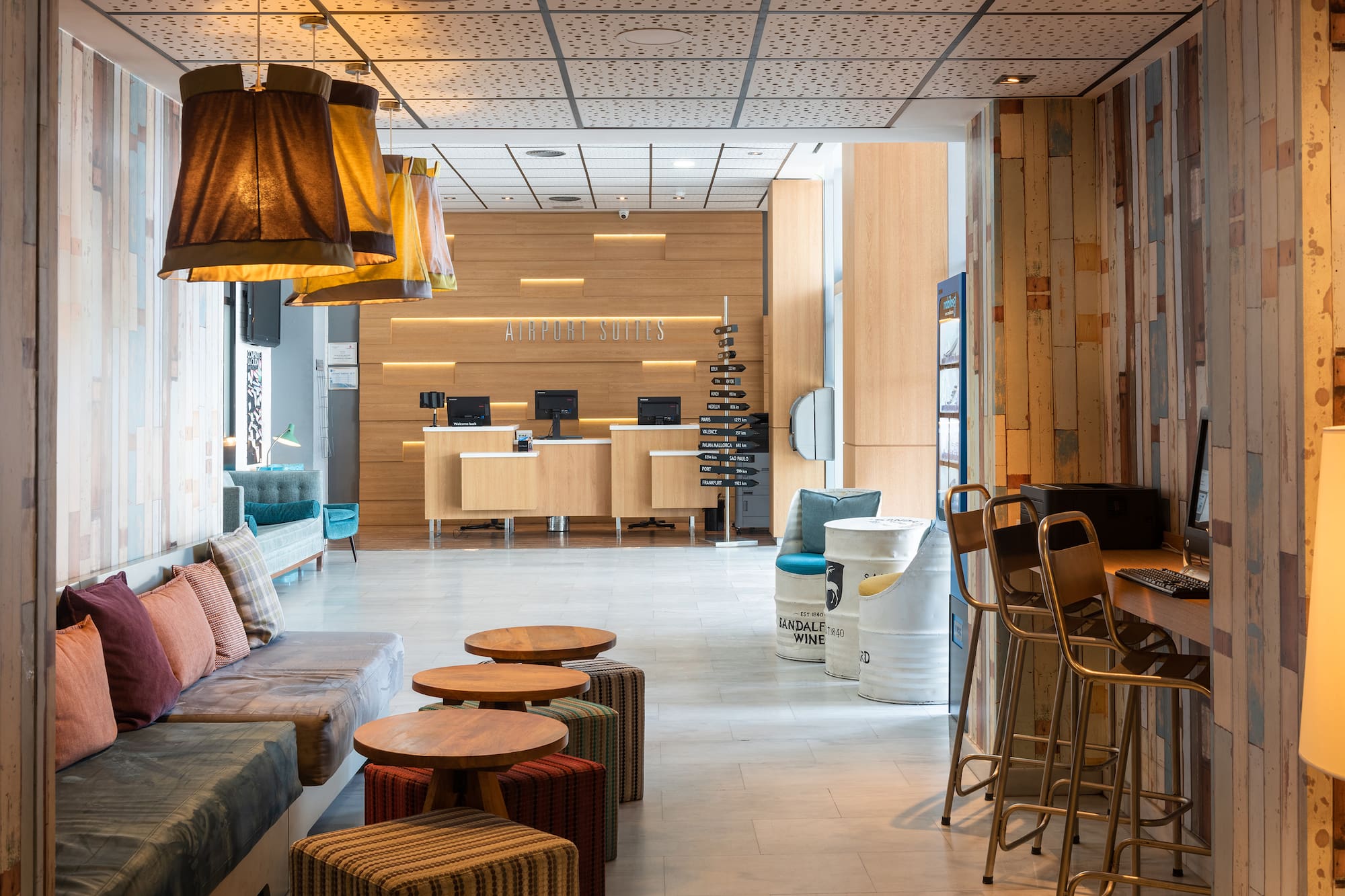 a lobby with a couch and tables
