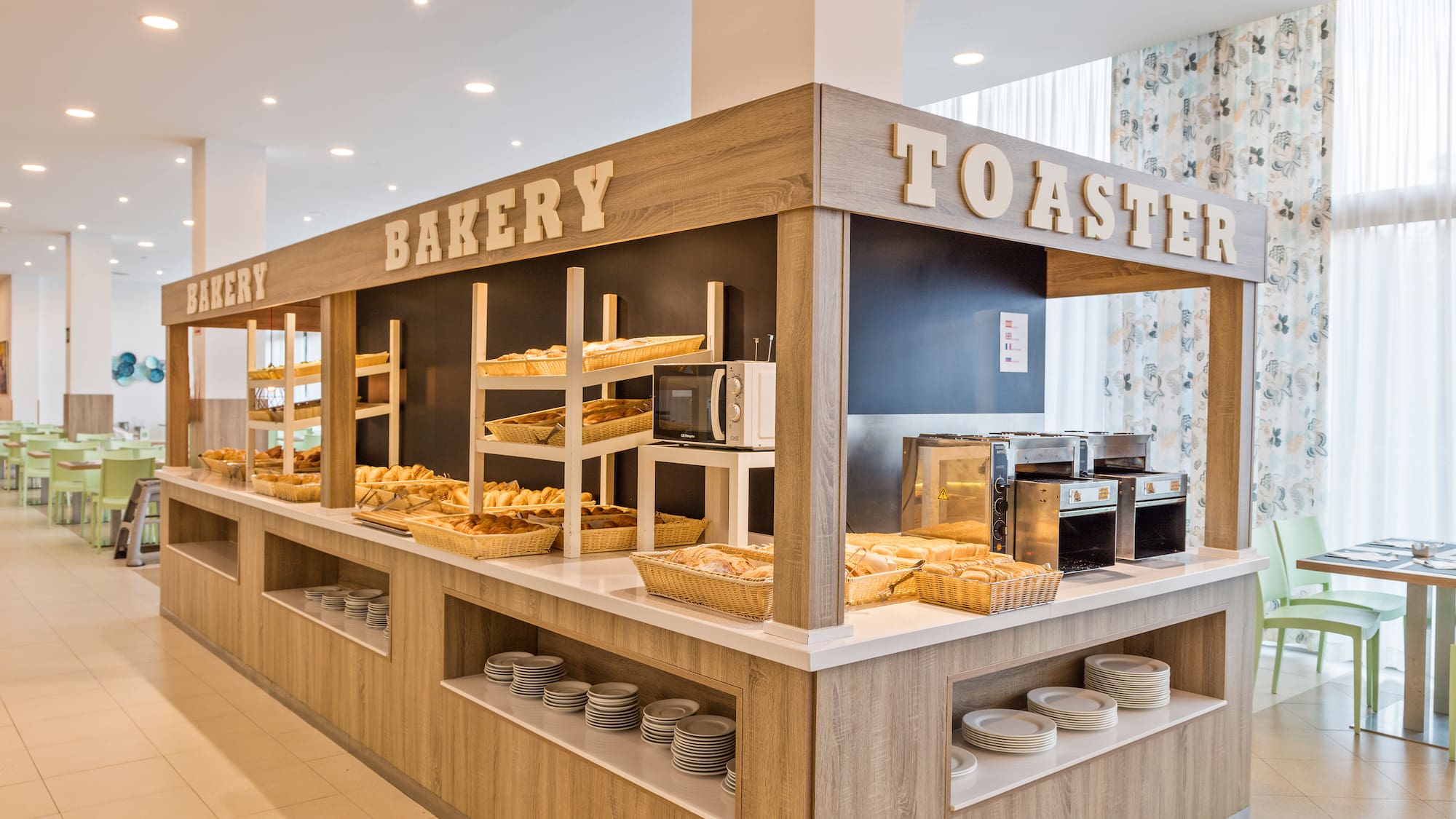 a bakery with many breads on shelves