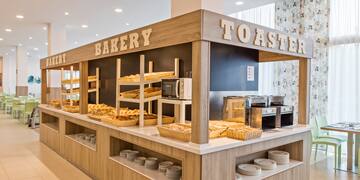 a bakery with many breads on shelves