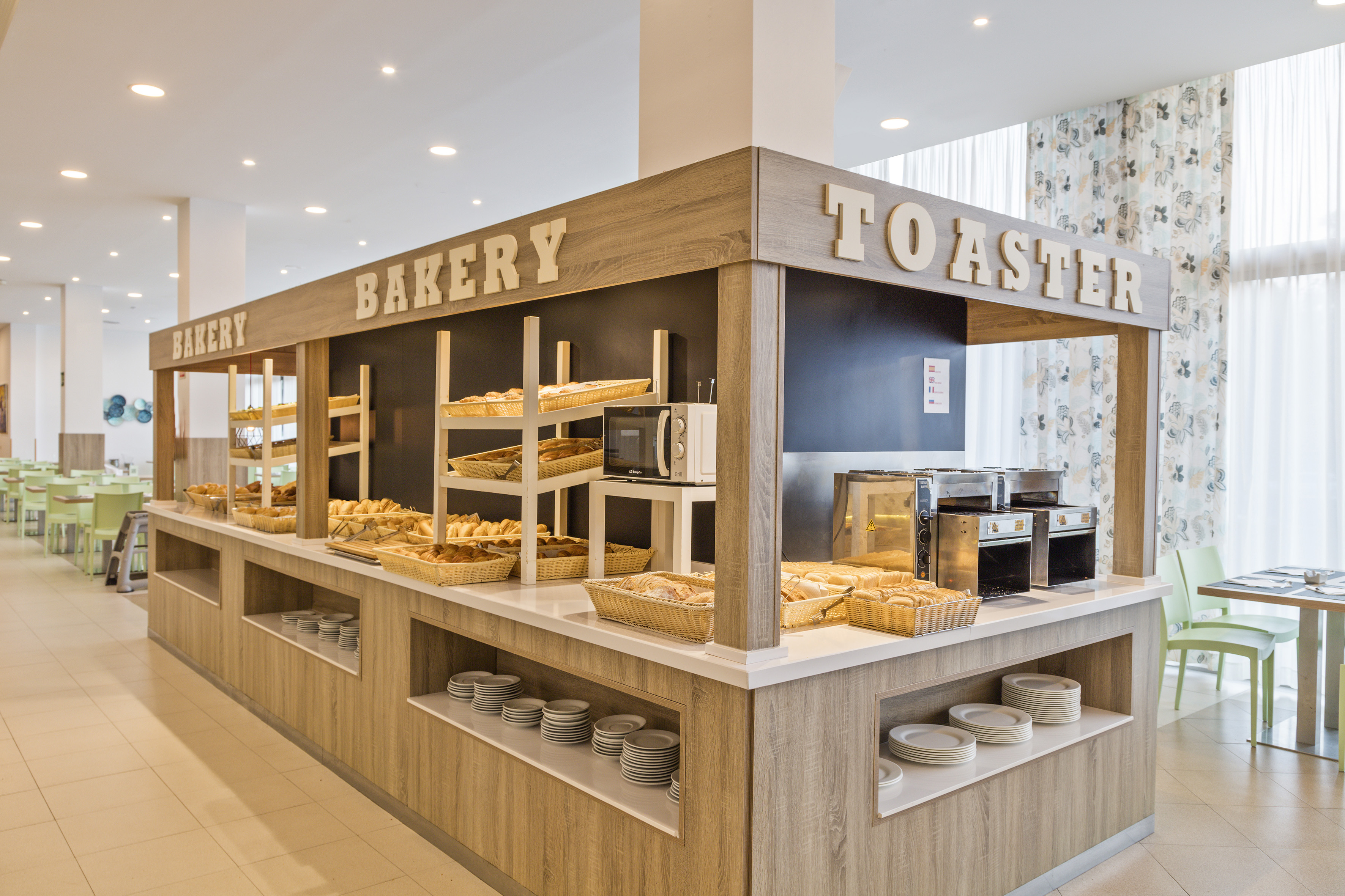 a bakery with many breads on shelves
