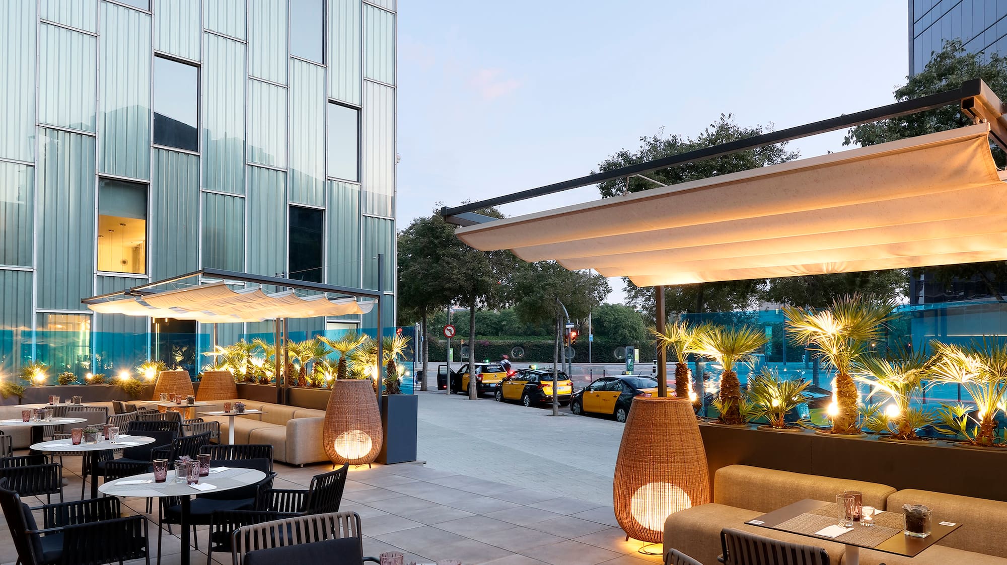 a patio with tables and chairs