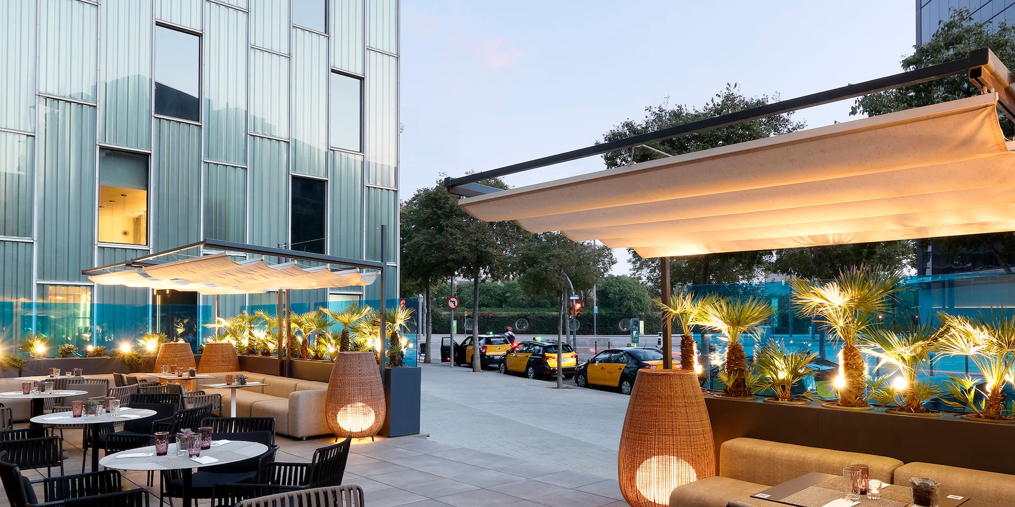 a patio with tables and chairs