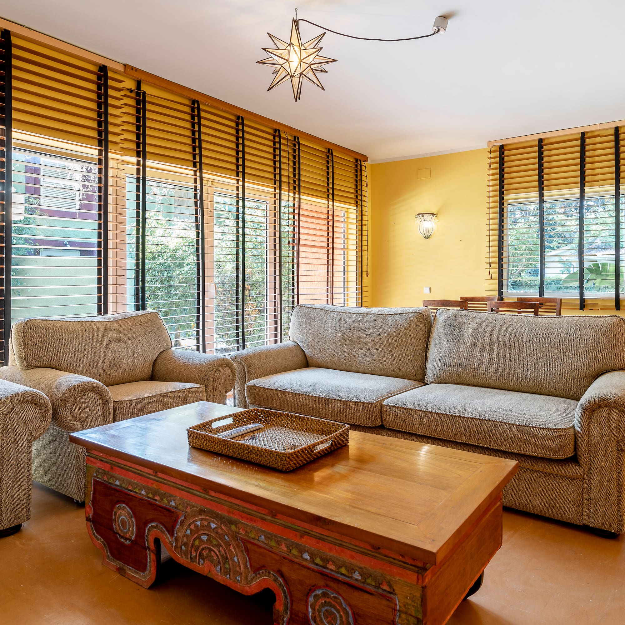 a living room with couches and a coffee table