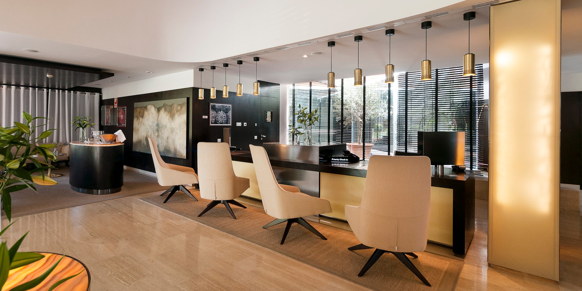 a room with a reception desk and chairs