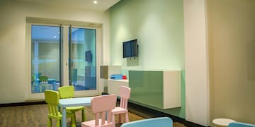 a room with a table and chairs
