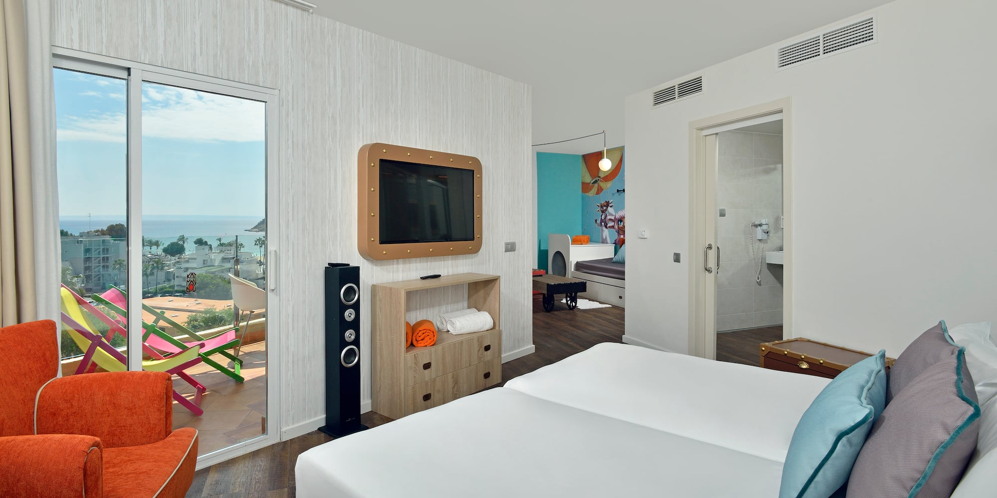 a room with a television and a bed