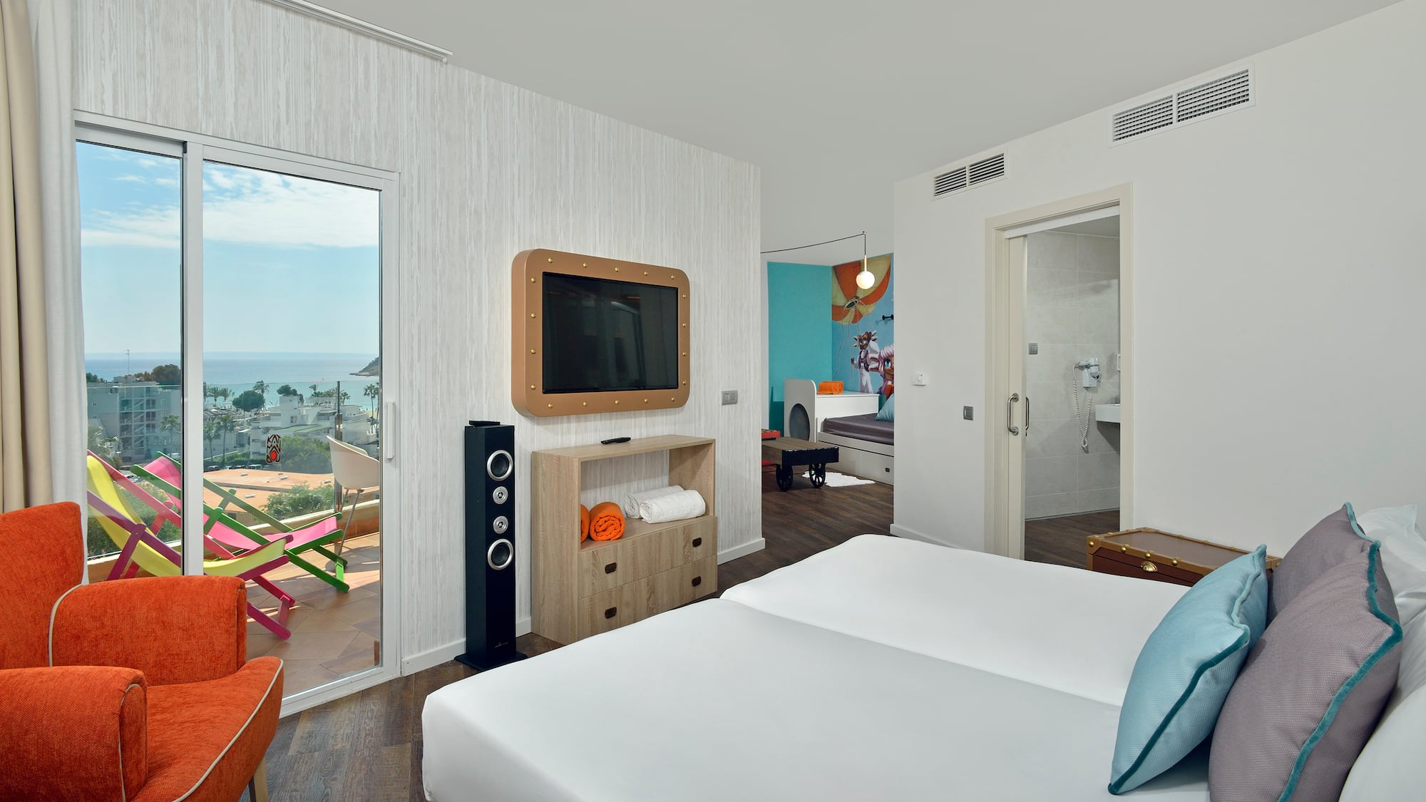 a room with a television and a bed