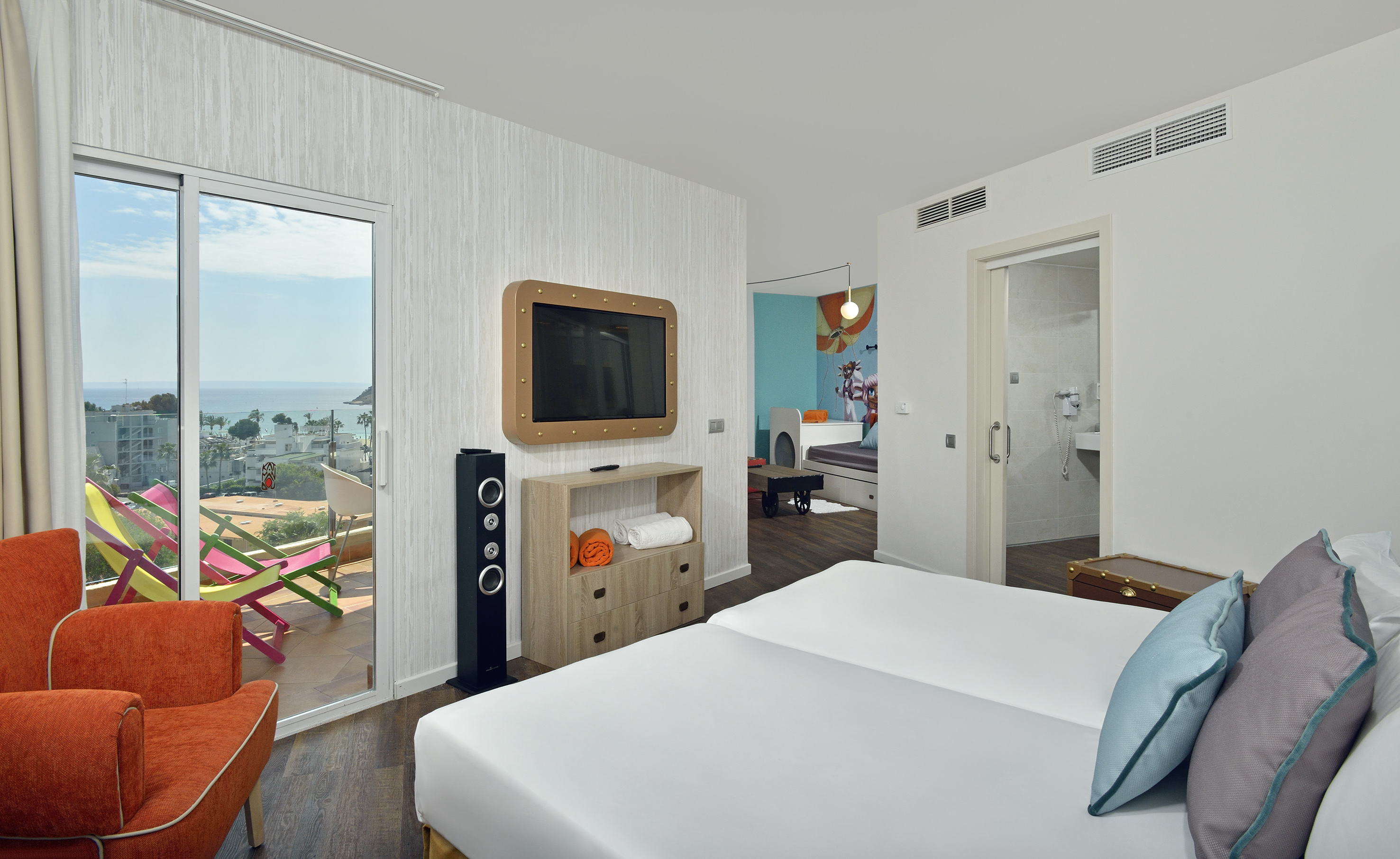 a room with a television and a bed