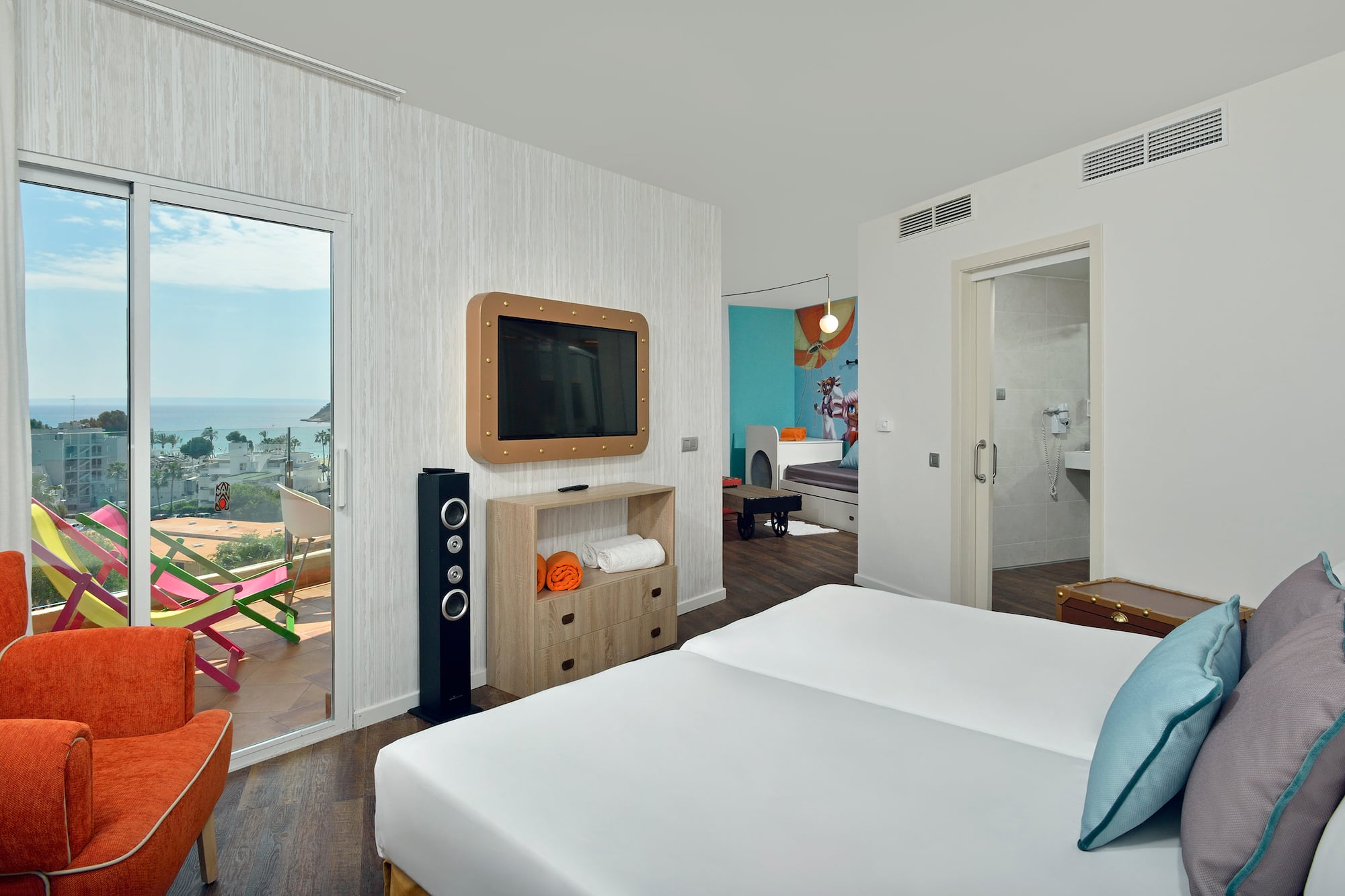 a room with a television and a bed