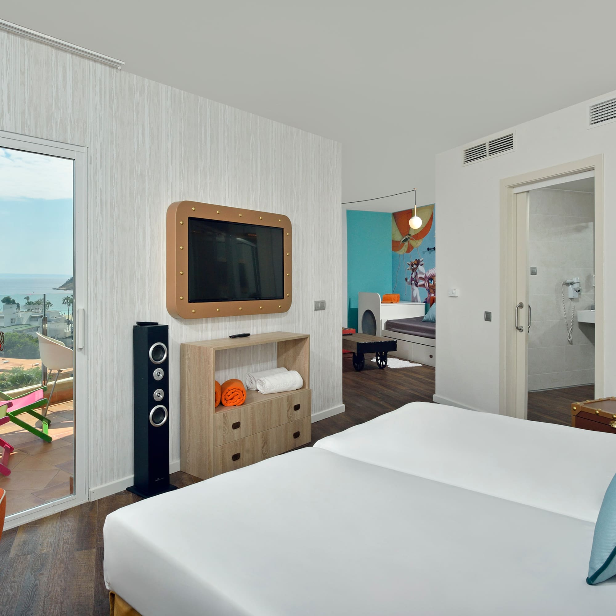 a room with a television and a bed