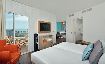 a room with a television and a bed