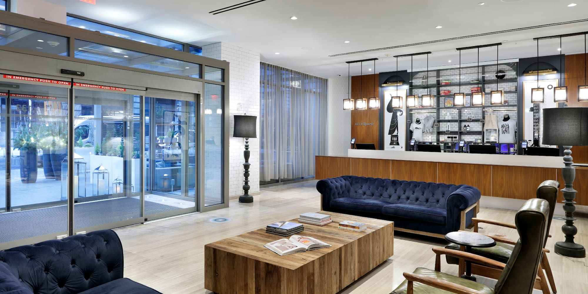 a lobby with a reception desk and couches