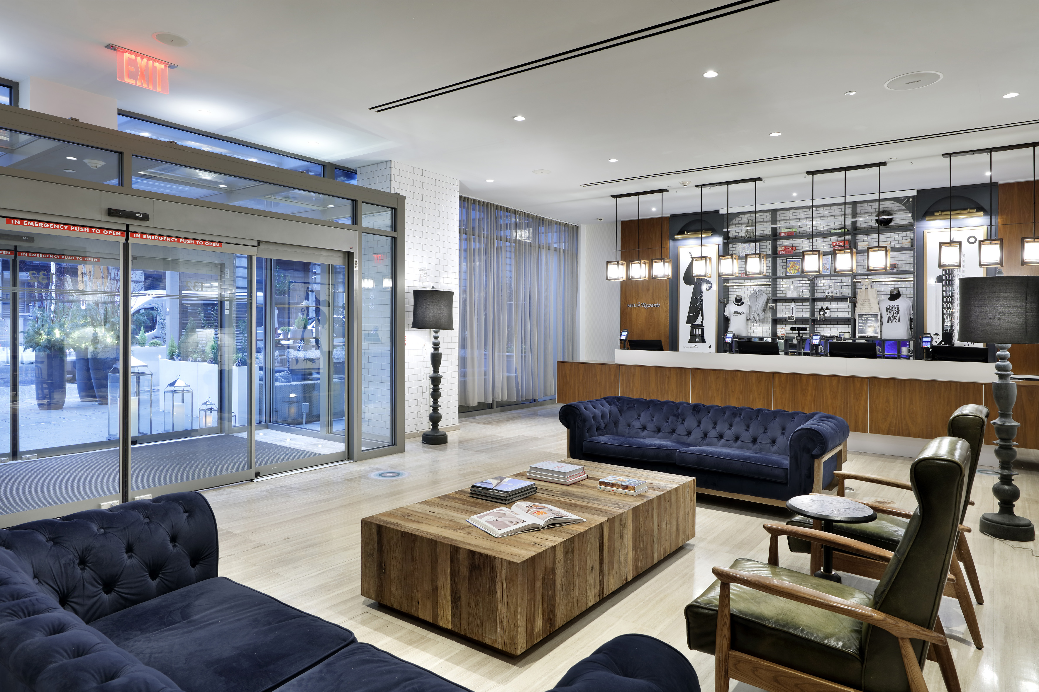 a lobby with a reception desk and couches