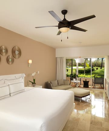a room with a bed and a ceiling fan
