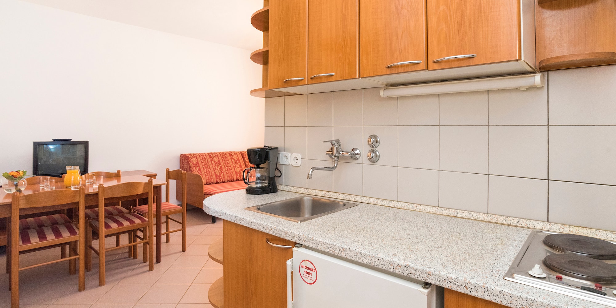 a kitchen with a table and chairs