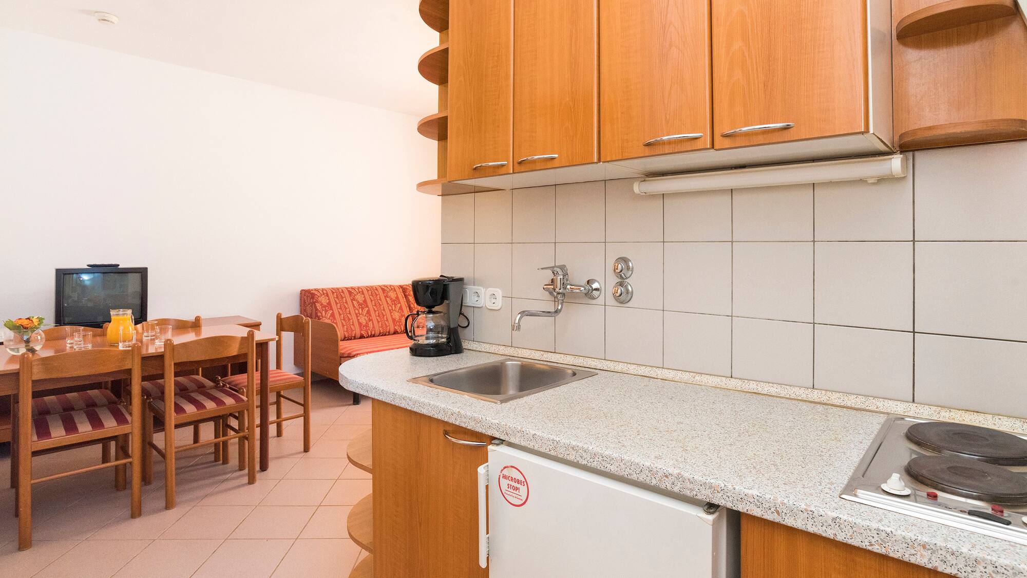 a kitchen with a table and chairs