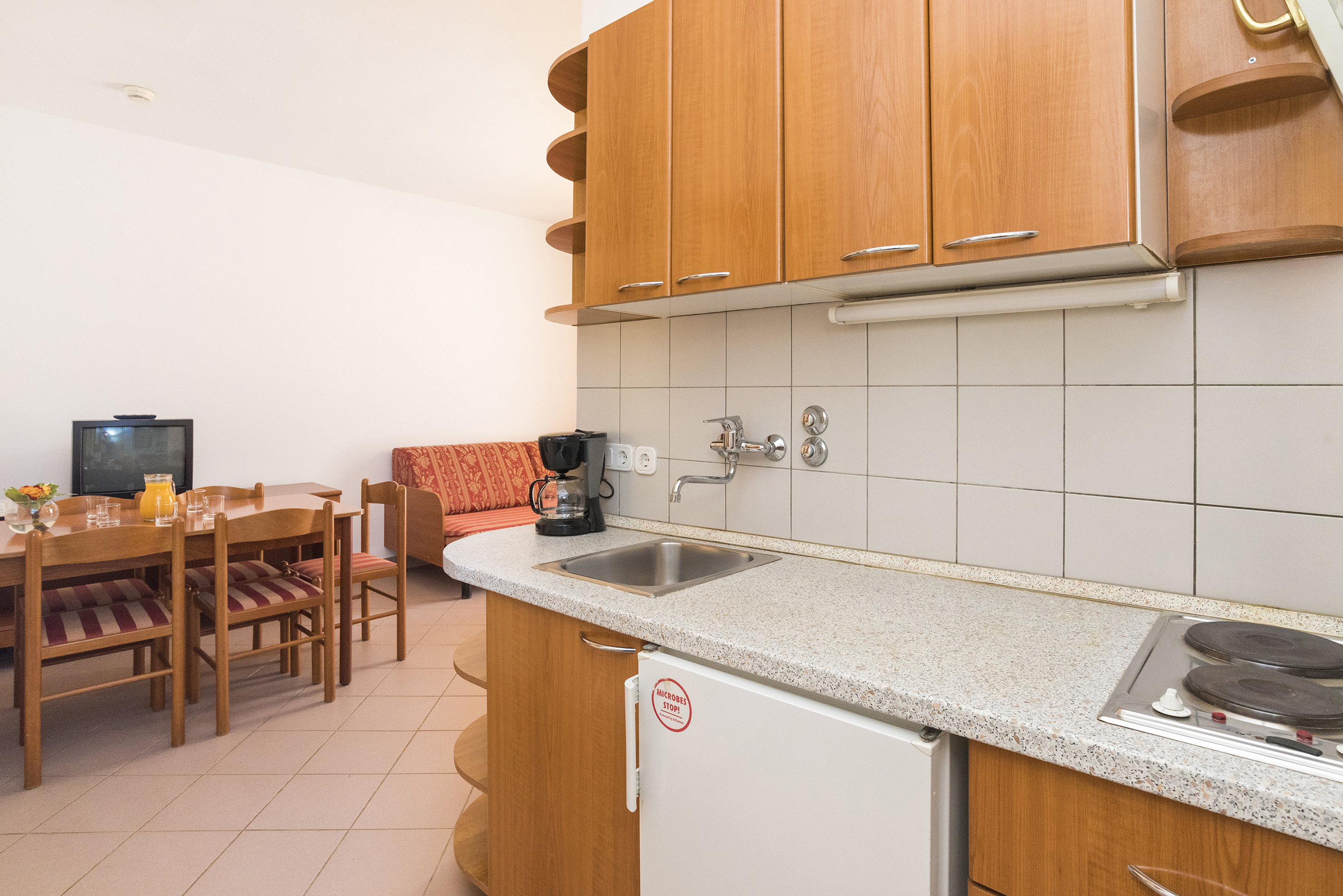 a kitchen with a table and chairs