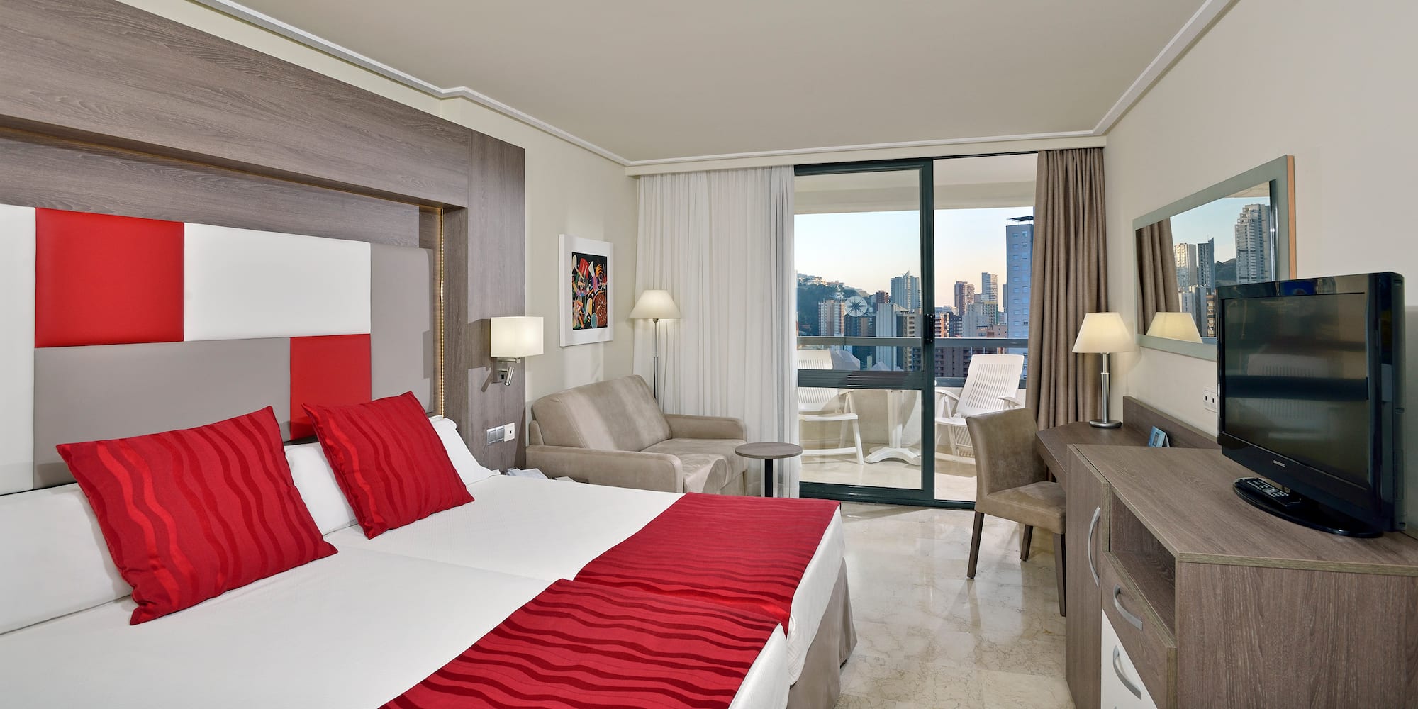 a hotel room with a bed and a table