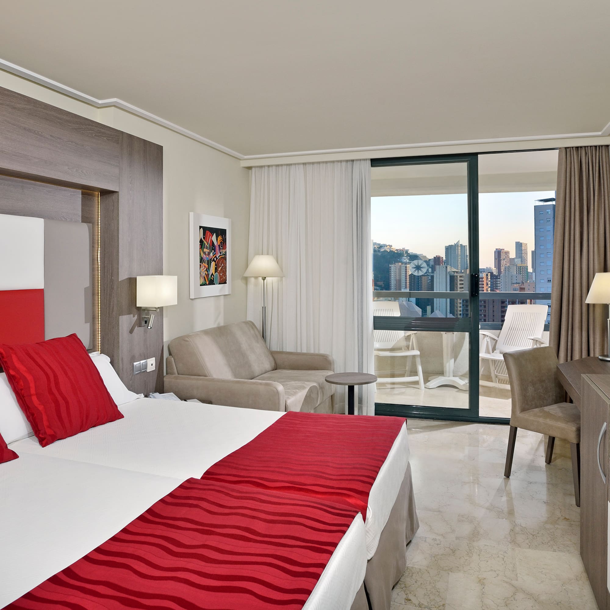 a hotel room with a bed and a table