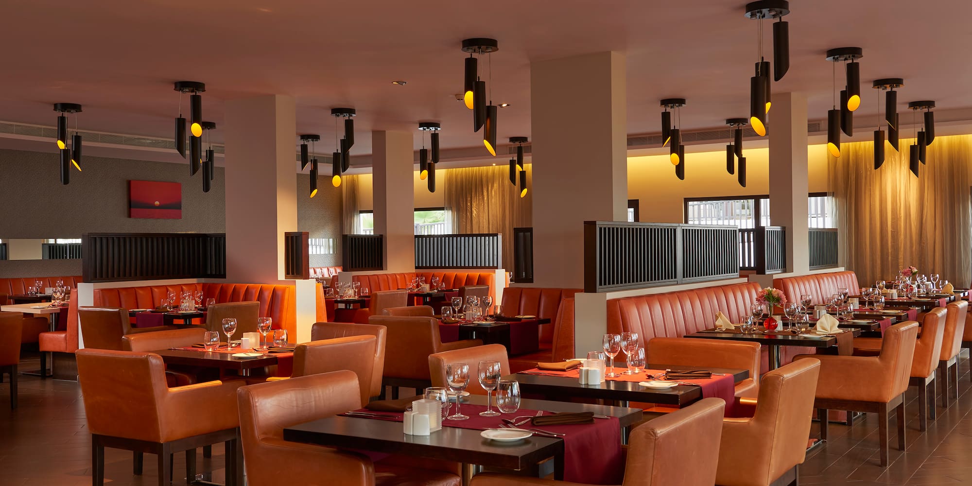 a restaurant with tables and chairs