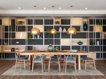 a dining room with a table and chairs