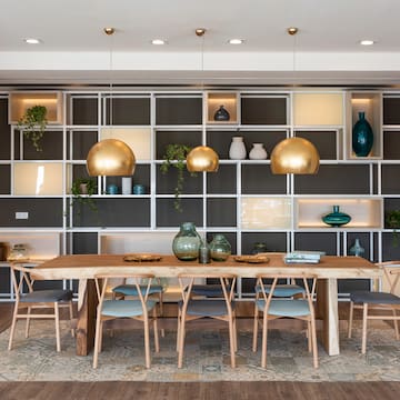 a dining room with a table and chairs