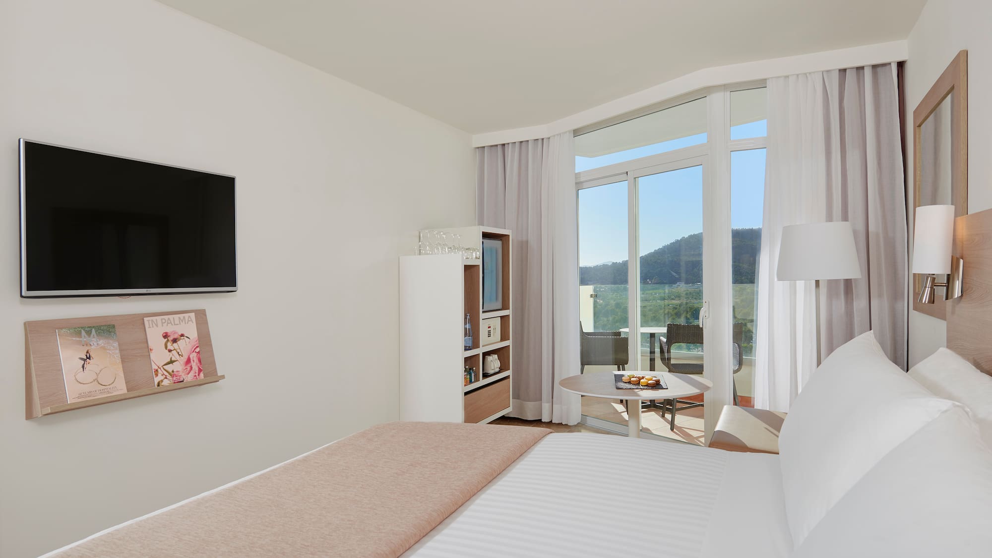 a bedroom with a television and a bed