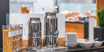 a group of metal containers on a counter
