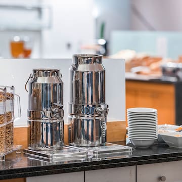 a group of metal containers on a counter