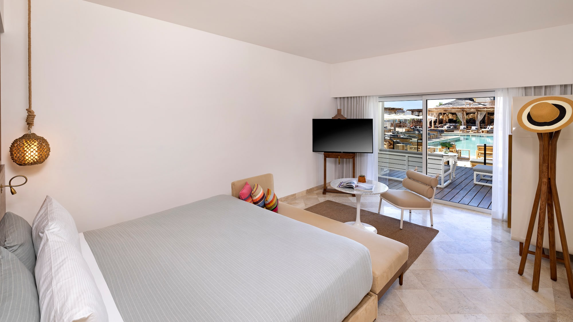 a bedroom with a television and a bed