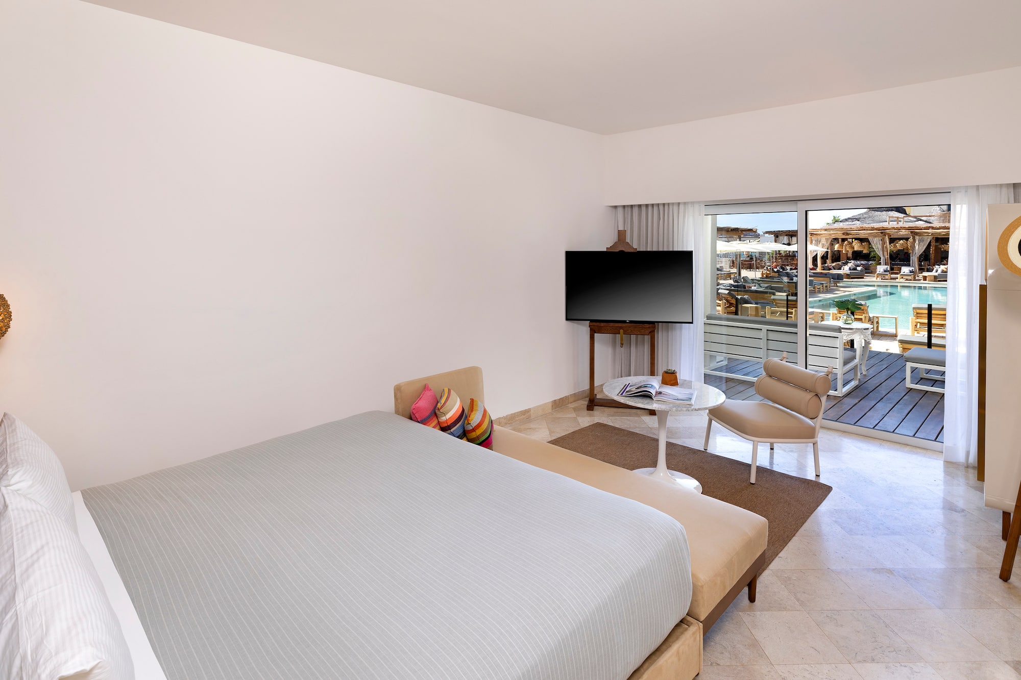 a bedroom with a television and a bed