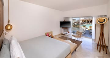 a bedroom with a television and a bed