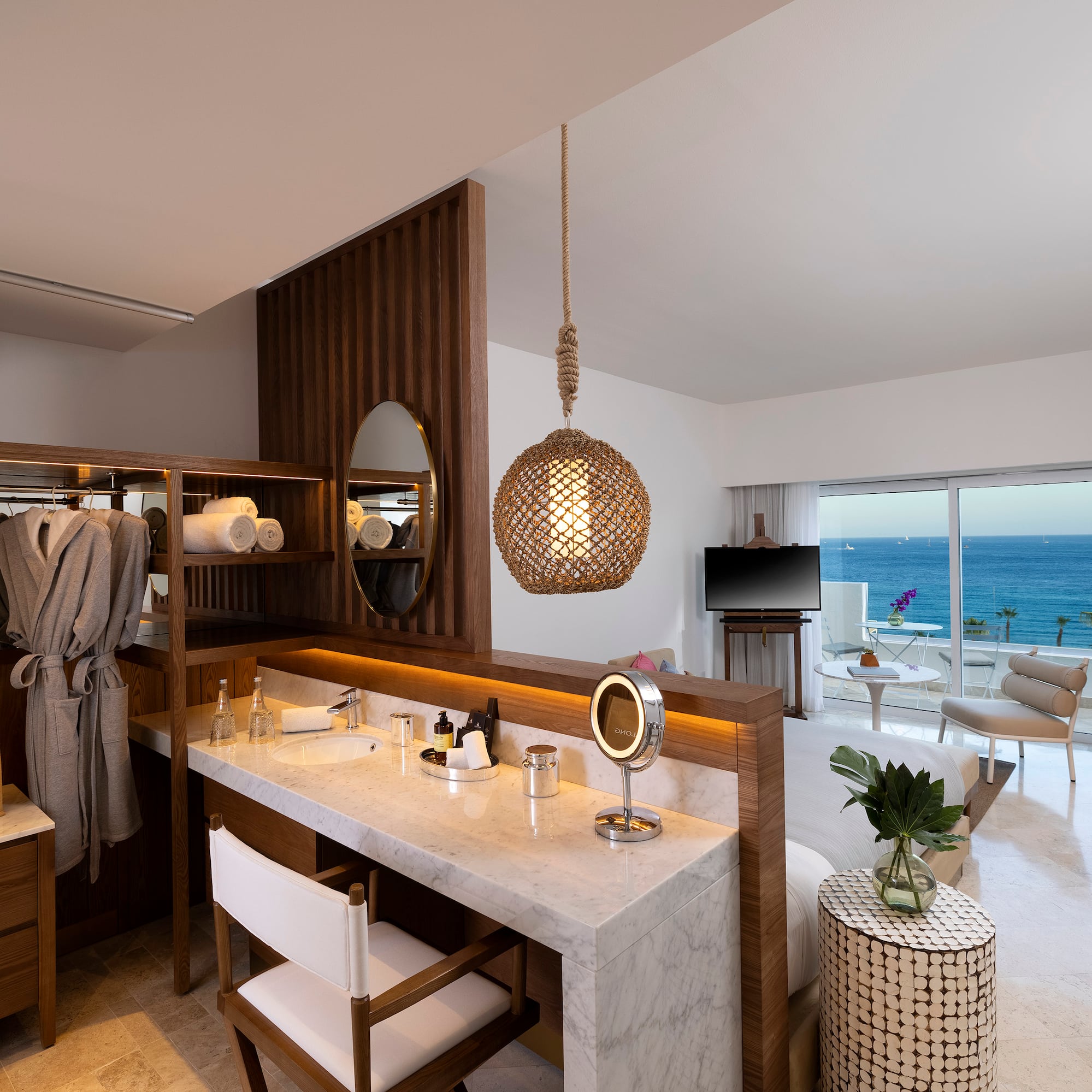 a room with a large mirror and a large table