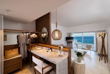 a room with a large mirror and a large table