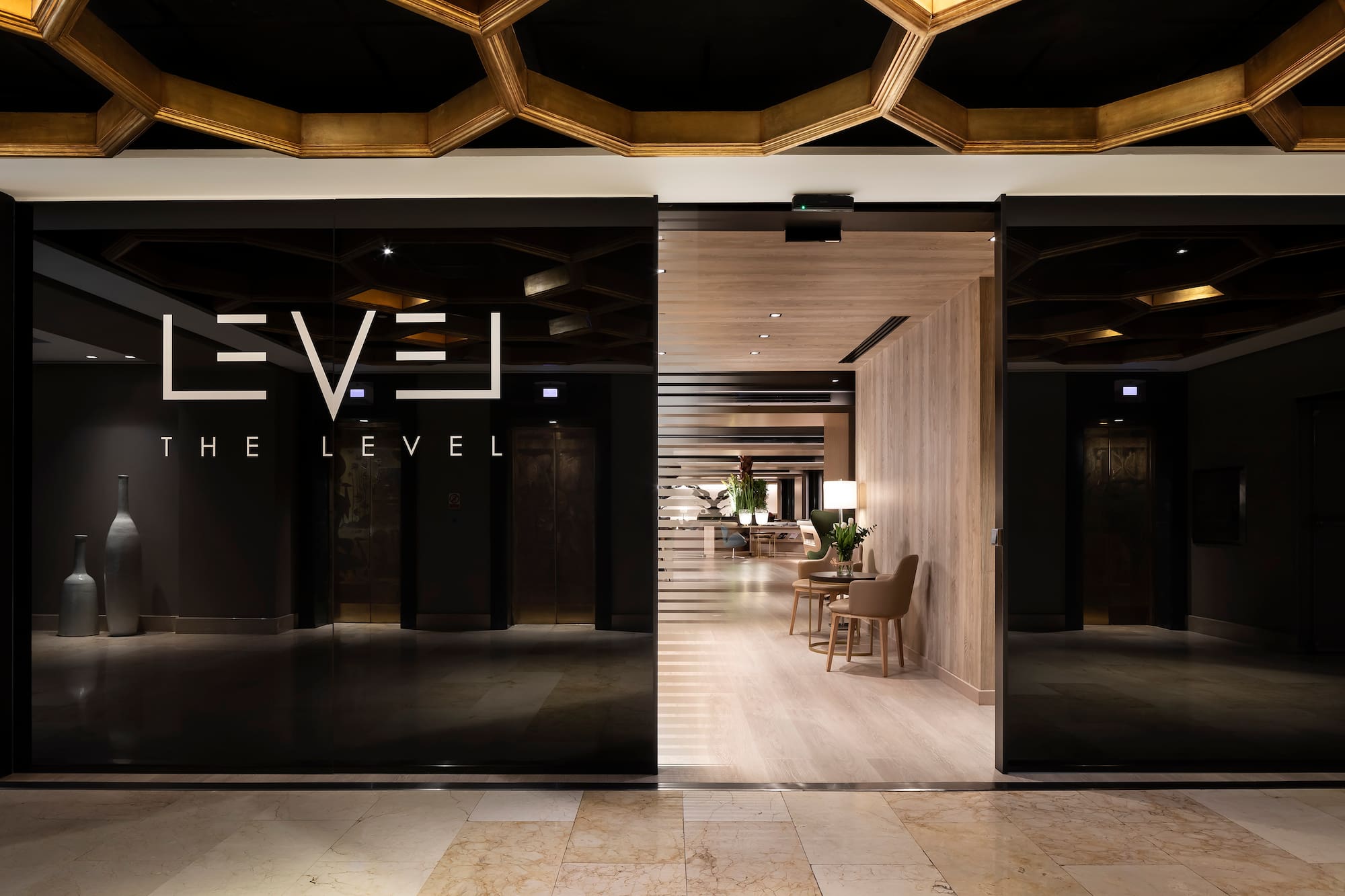 a glass door with a black sign