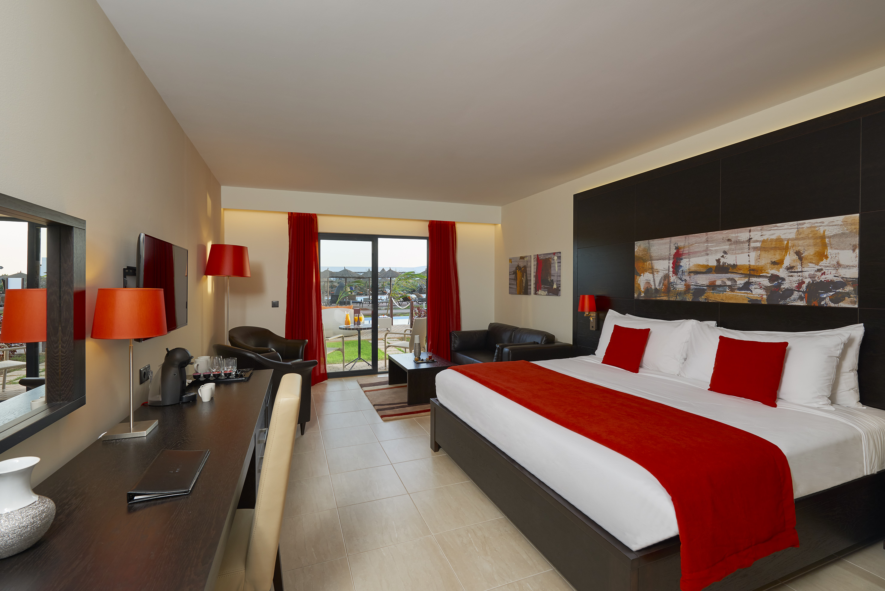 a room with a bed and a desk