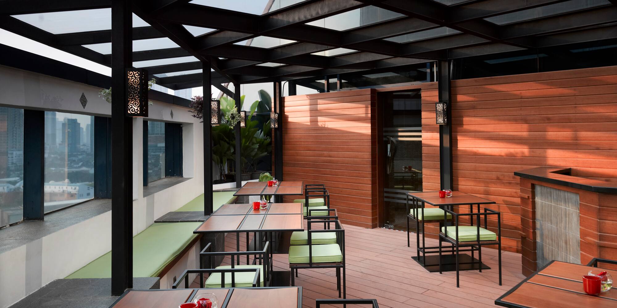 a patio with tables and chairs