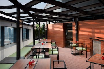 a patio with tables and chairs