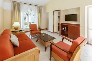 a living room with a television and a couch