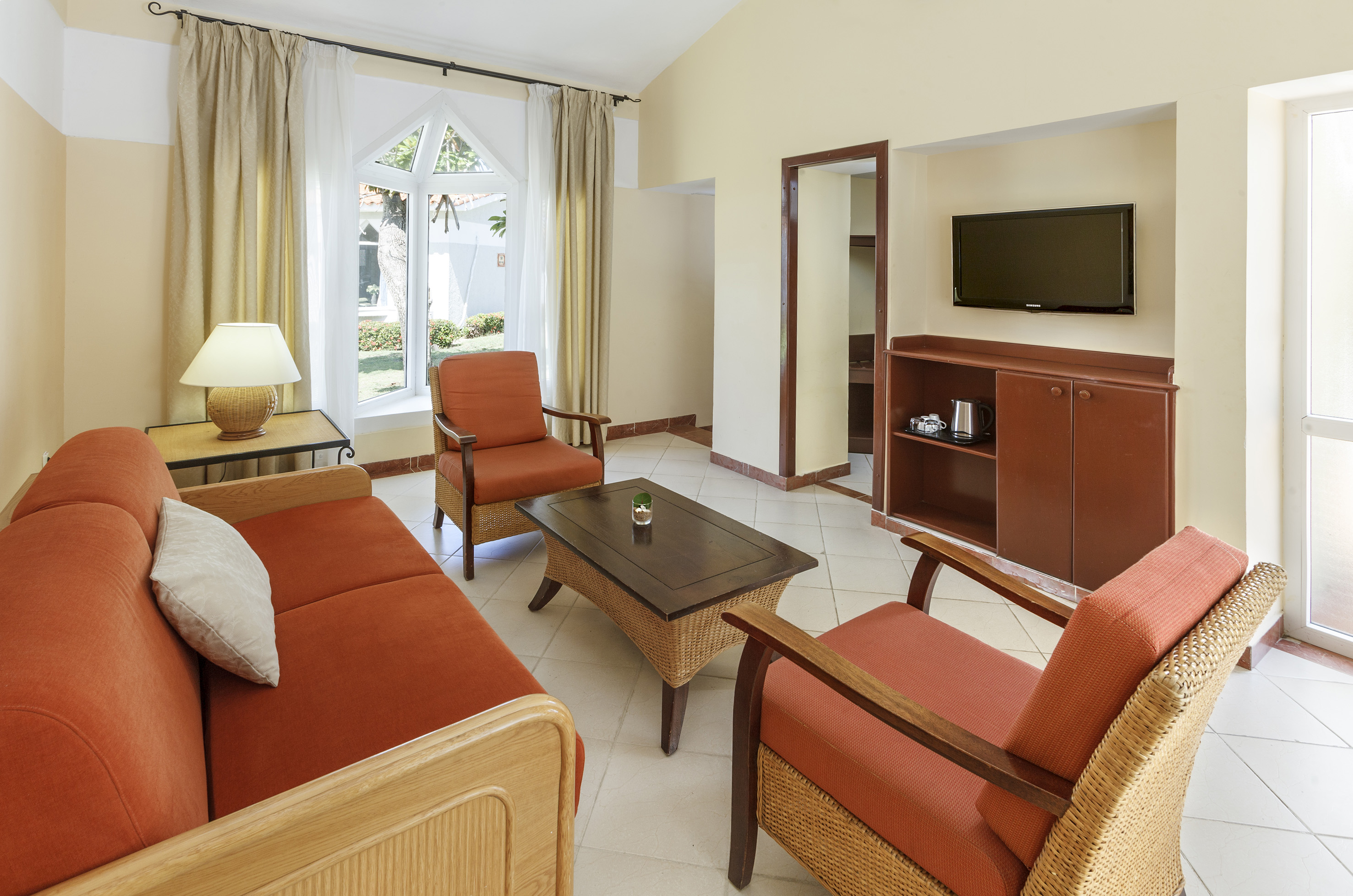 a living room with a television and a couch