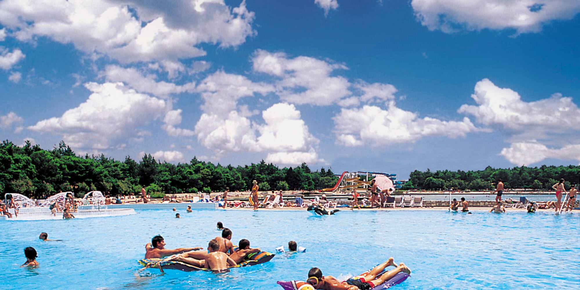 a group of people in a pool