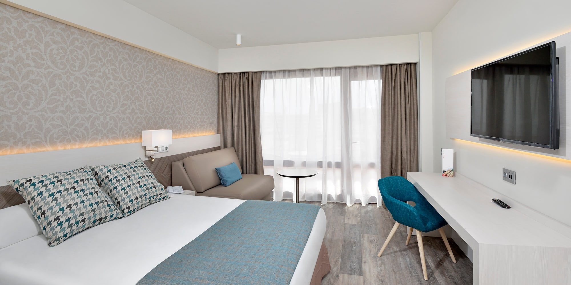 a room with a bed and a desk